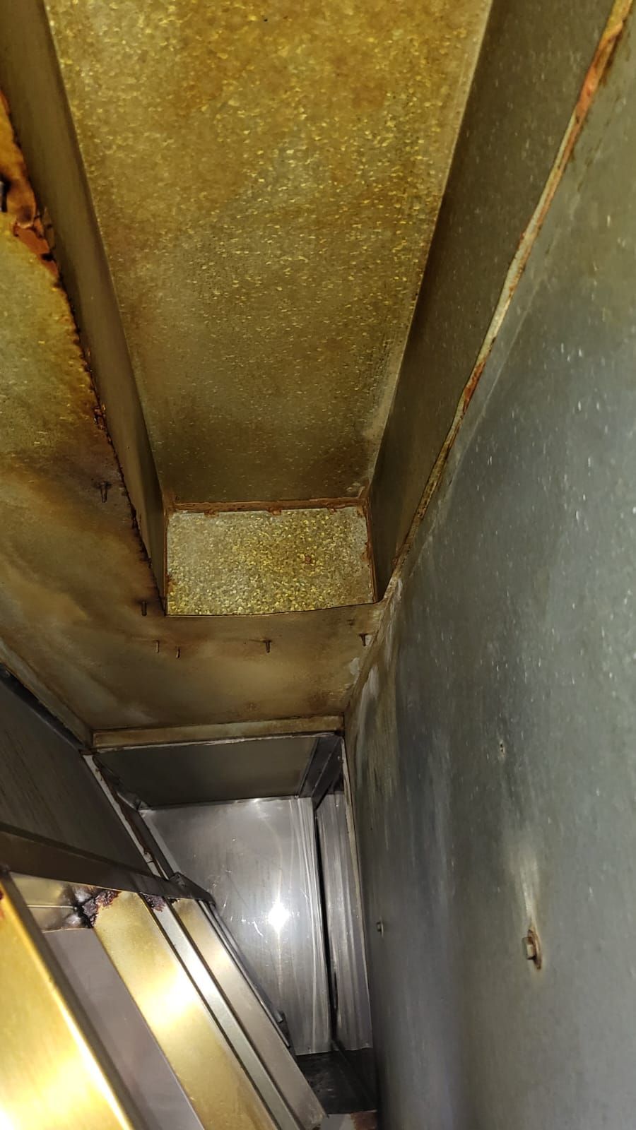 A close up of a dirty ceiling in a room.
