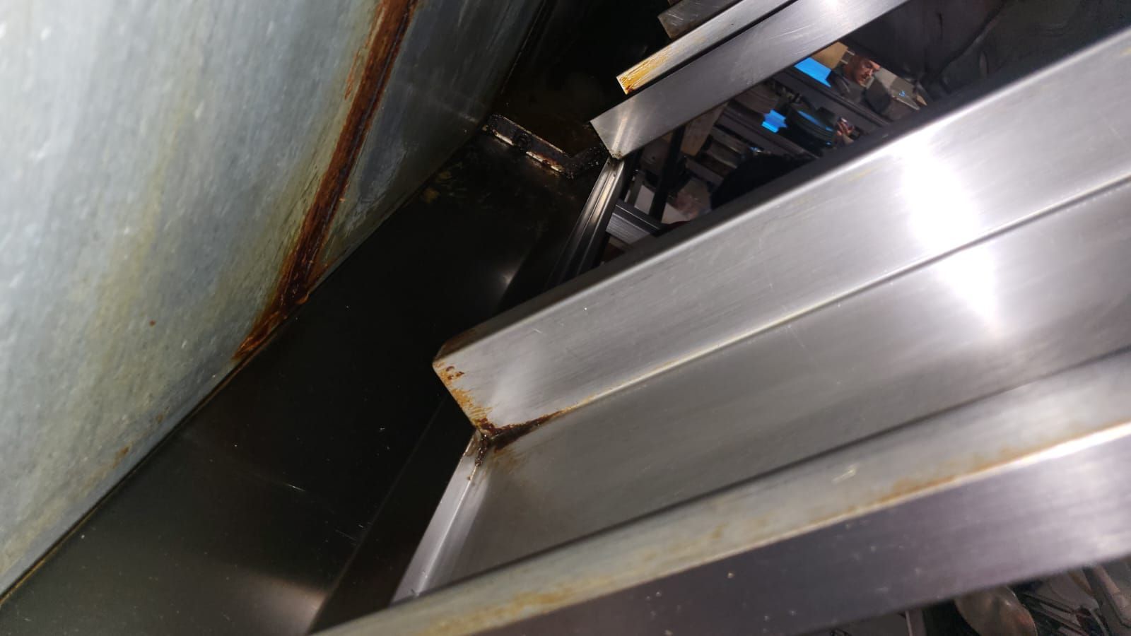 A close up of a stainless steel sink in a kitchen.