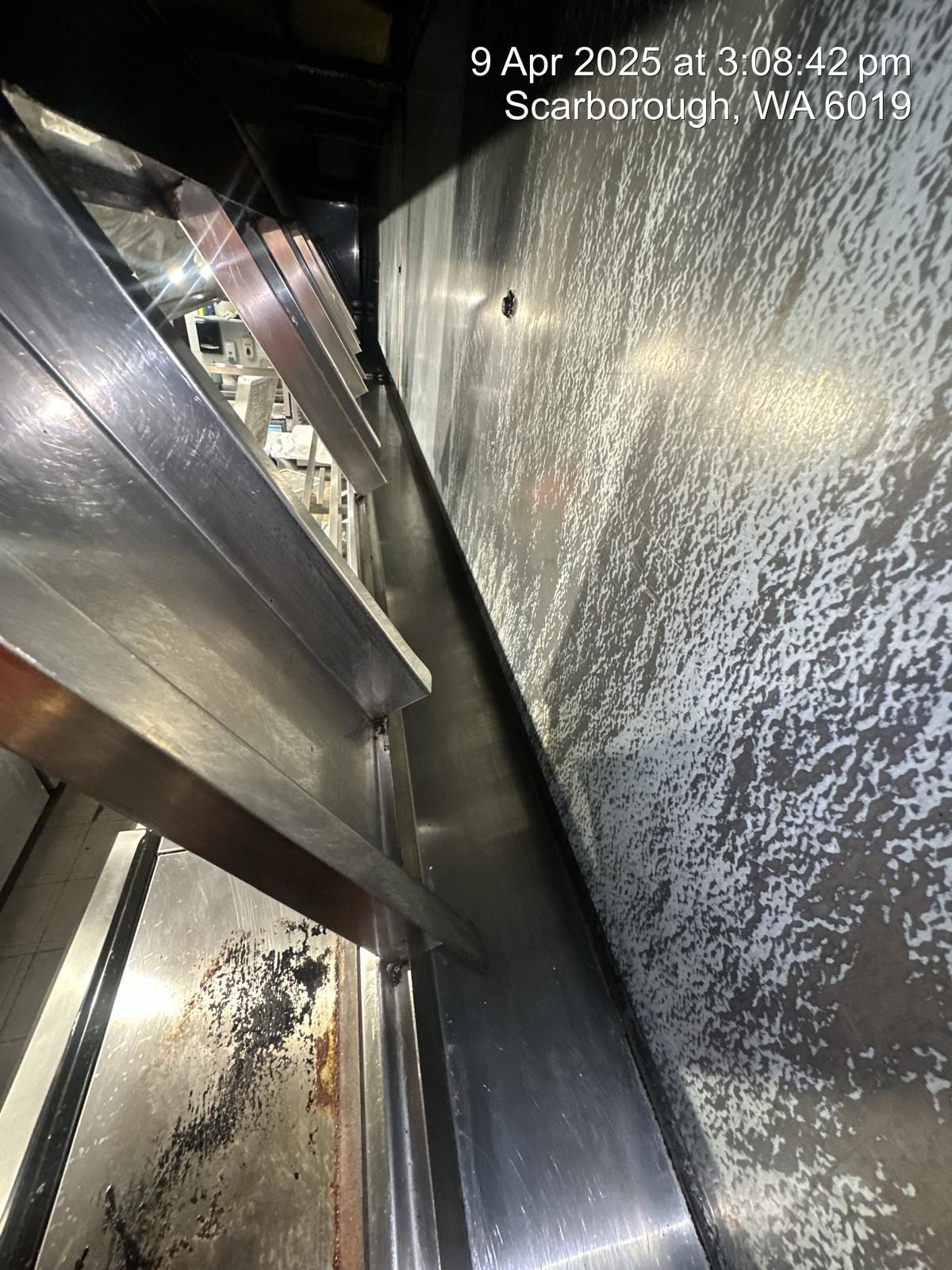 A black stove top oven is sitting on top of a counter in a kitchen.