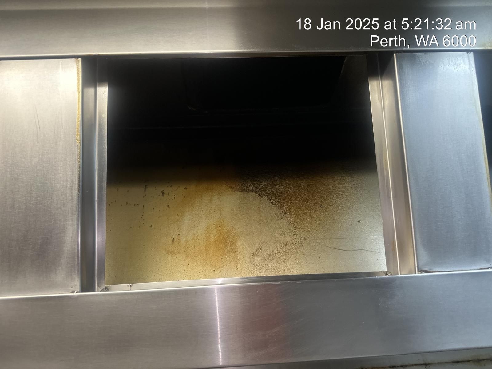 A picture of a stainless steel hood taken on january 18th