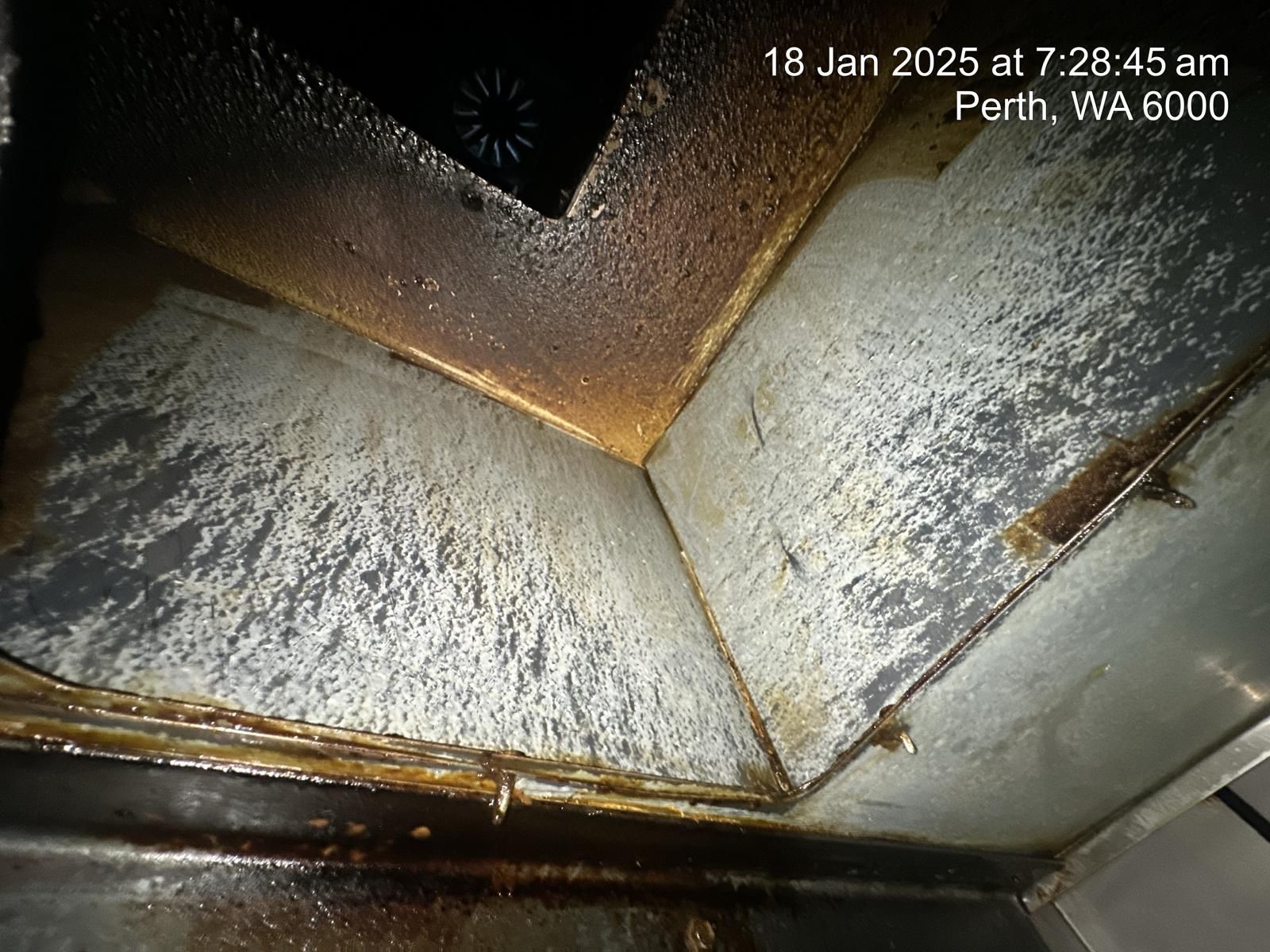 A picture of a dirty kitchen hood taken on january 18 , 2025.