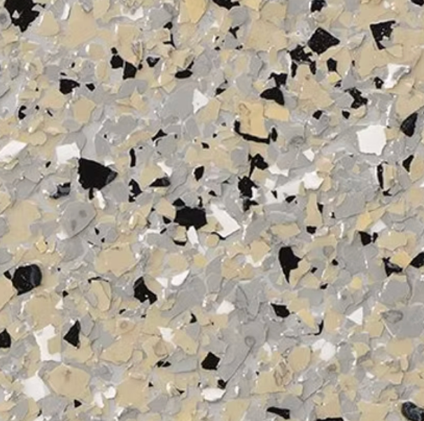 Close-up of a speckled floor coating in light beige, gray, black, and white.