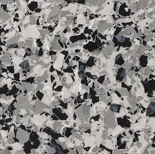 Gray, black, and white epoxy flooring with a speckled pattern.