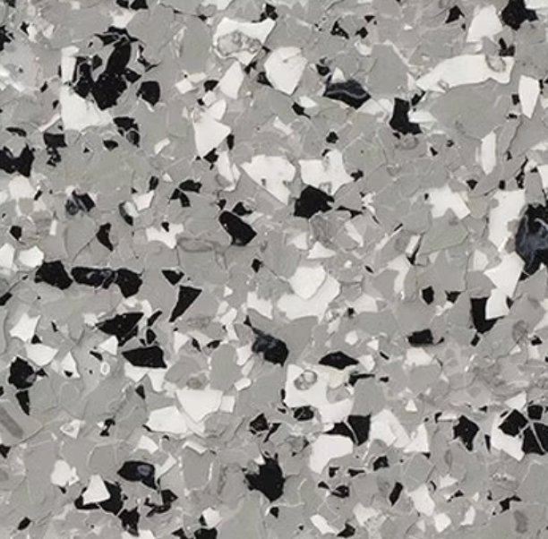 Gray, black, and white speckled epoxy flooring.
