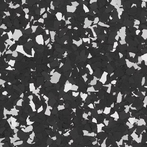 Black and white speckled flooring, with irregular shapes.