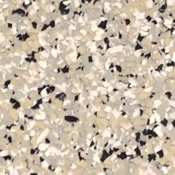 Speckled flooring pattern with beige, white, and black chips.