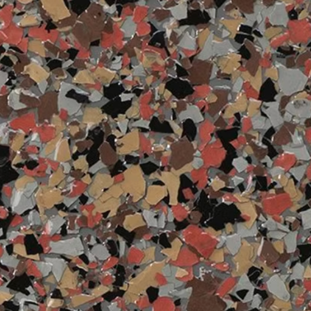 Multi-colored epoxy floor coating with red, black, brown, tan, and gray flakes.