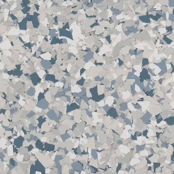 Blue, gray, and white speckled flooring, resembling a terrazzo design.