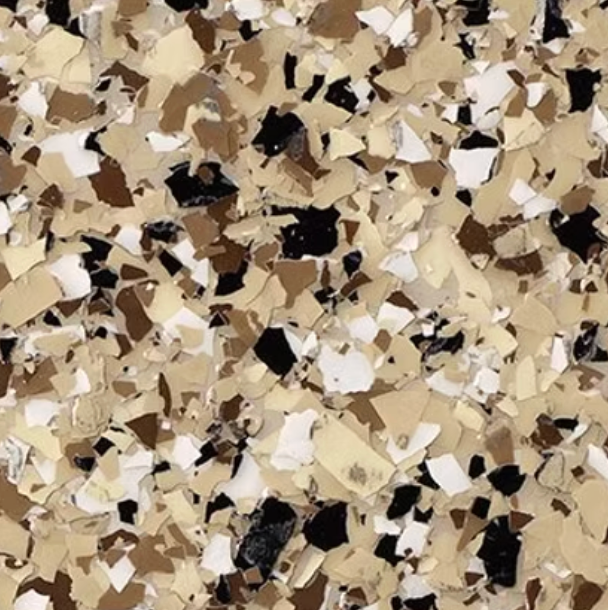 Speckled floor coating pattern with beige, brown, black, and white flakes.