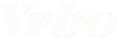 Vrbo logo in white with a stylized, striped font.