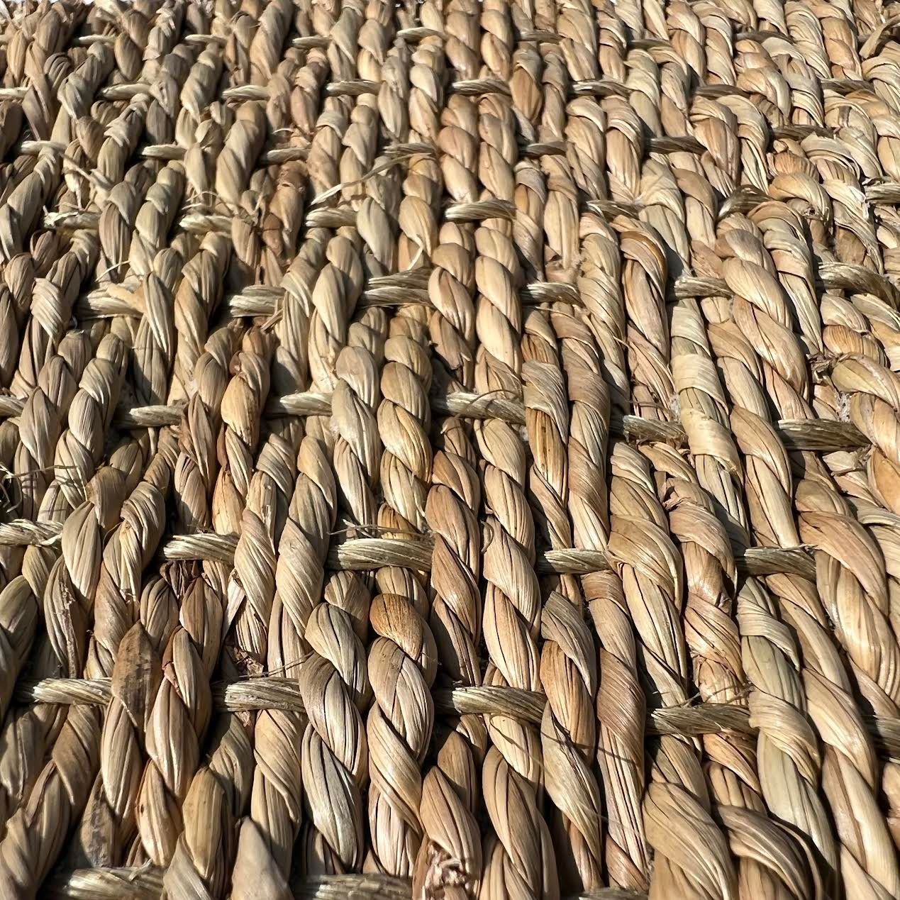 Photo of a sample of a unique flooring material called Seagrass that is used in the event flooring industry.