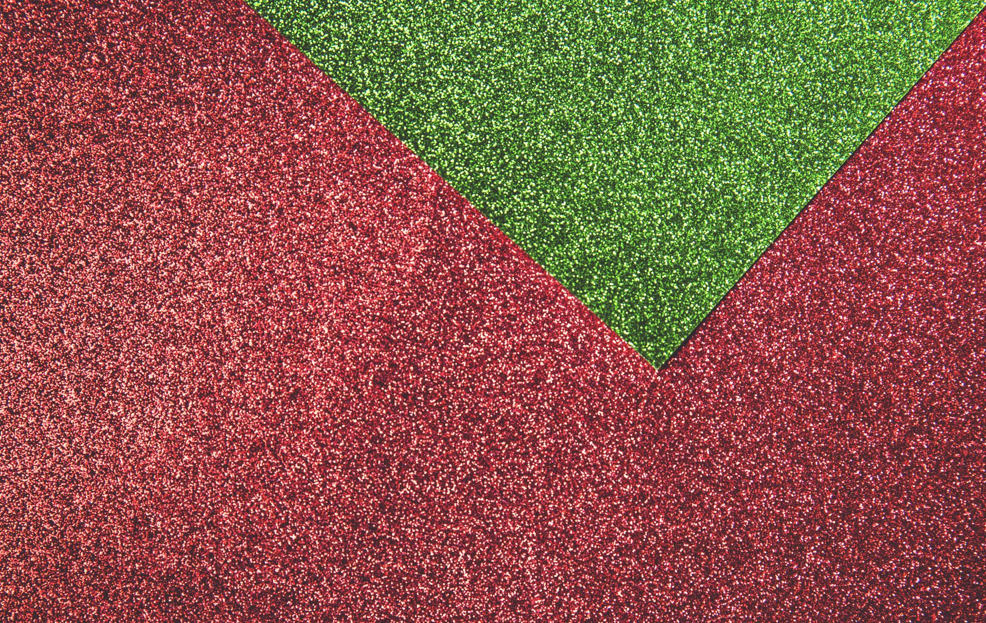 Photo of a sample of red and green artificial turn that is used for special events.