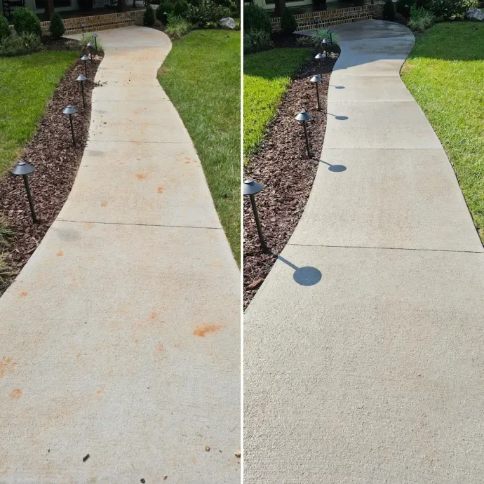 Comparison of a dirty concrete walkway and a clean one after power washing, outdoor setting.