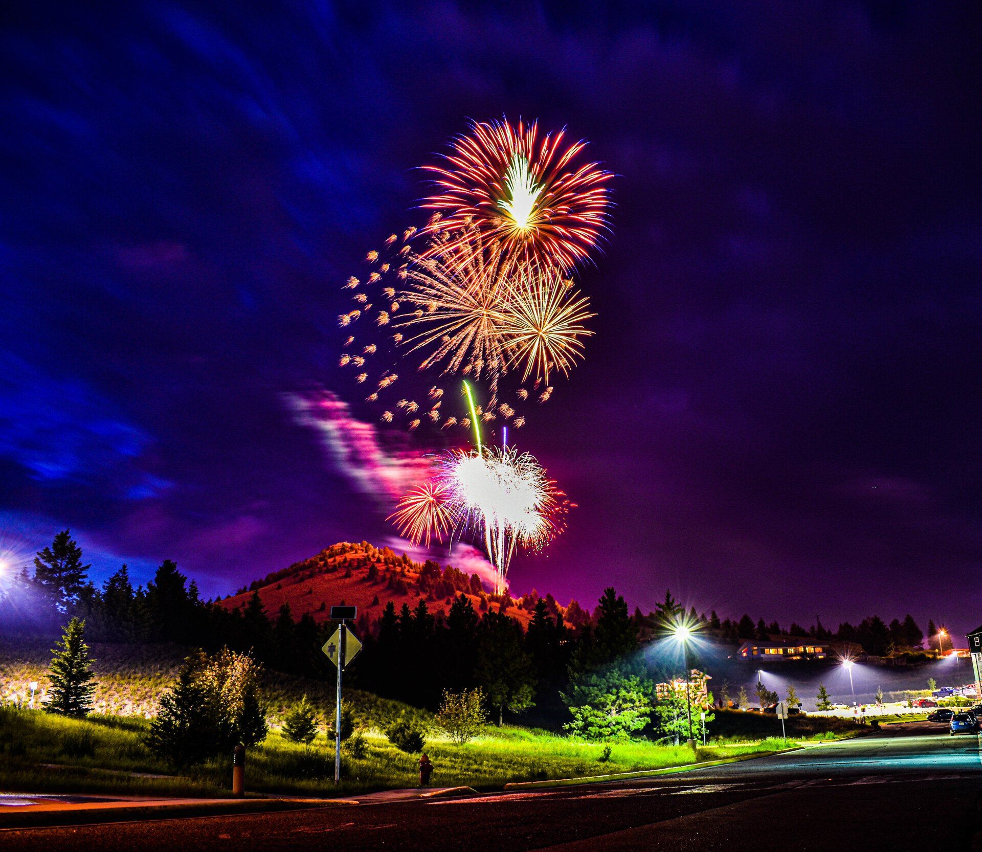 Fireworks exploding in the night sky over  Butte, MT