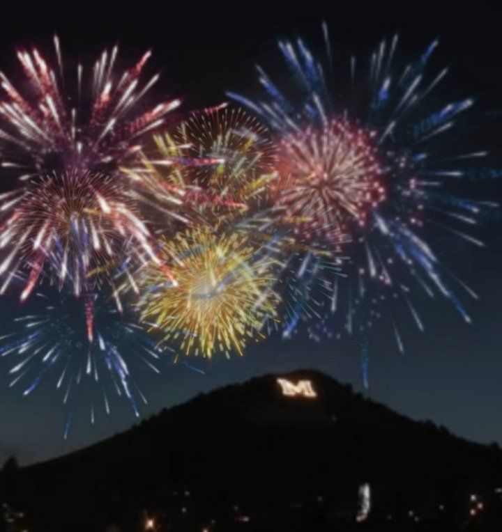 Fireworks exploding in the night sky over  Butte, MT