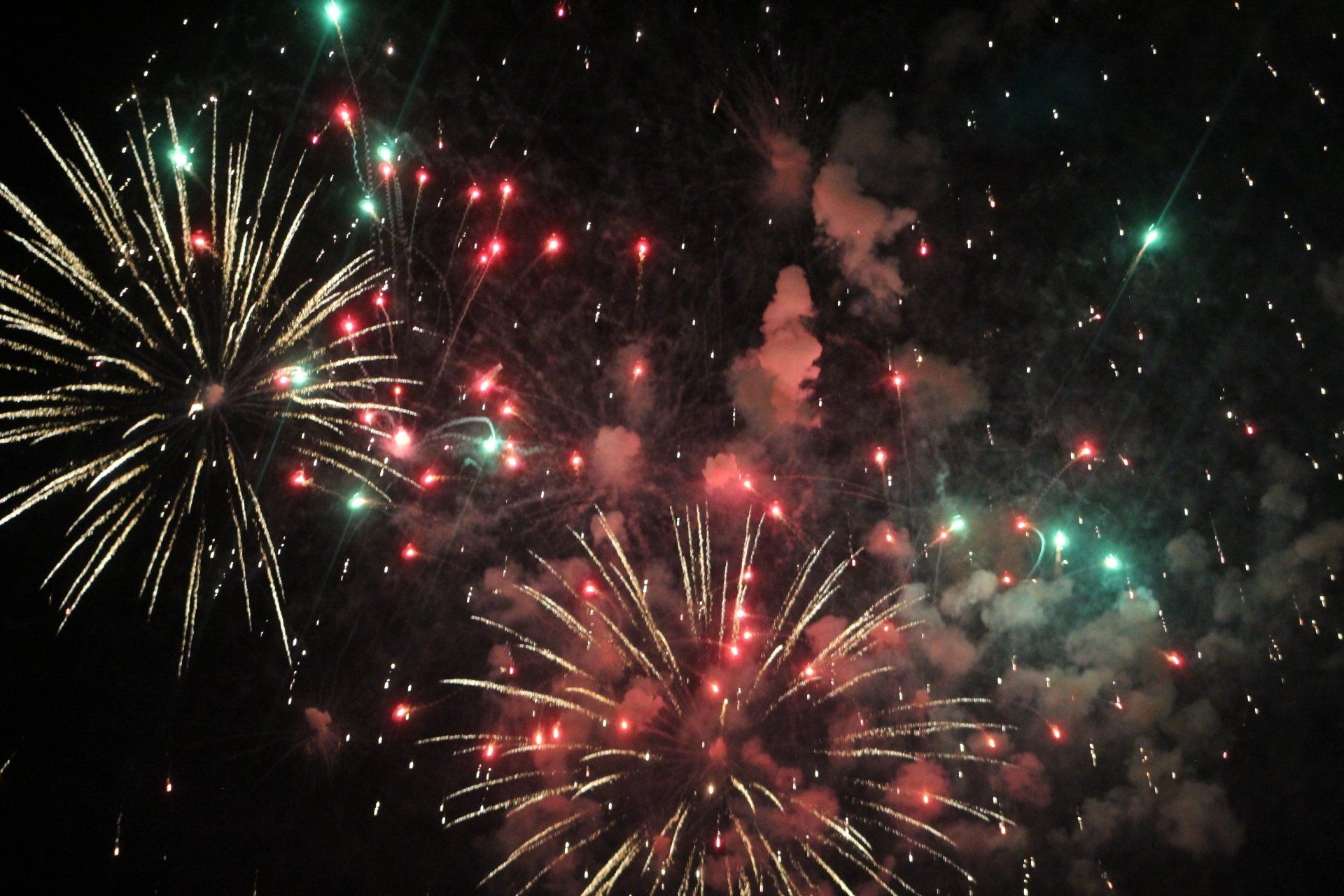 Fireworks exploding in the night sky over  Butte, MT