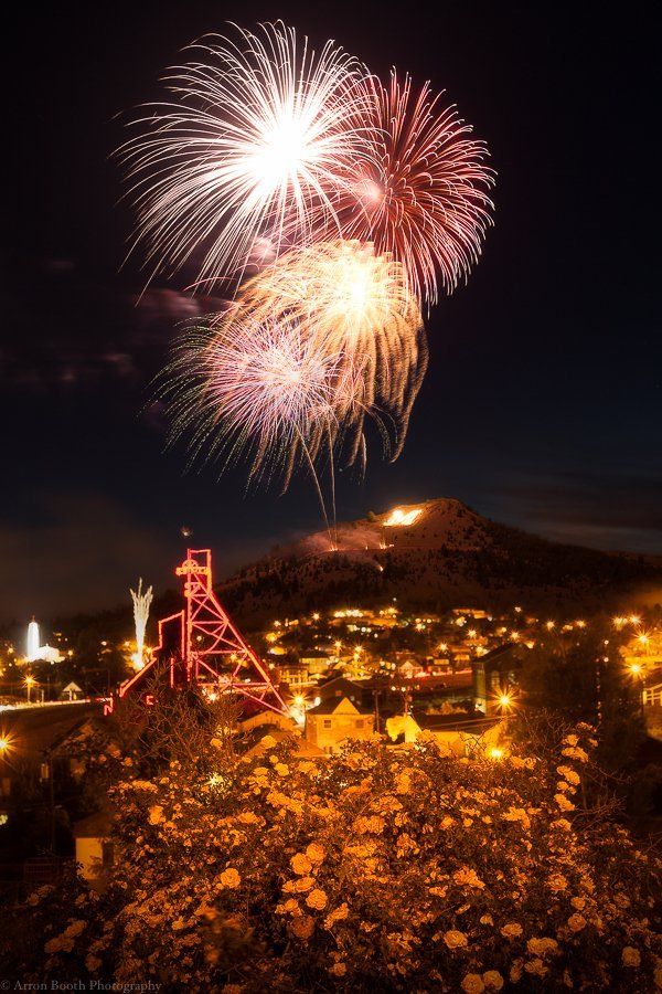 Arron Booth Fireworks exploding in the night sky over  Butte, MT