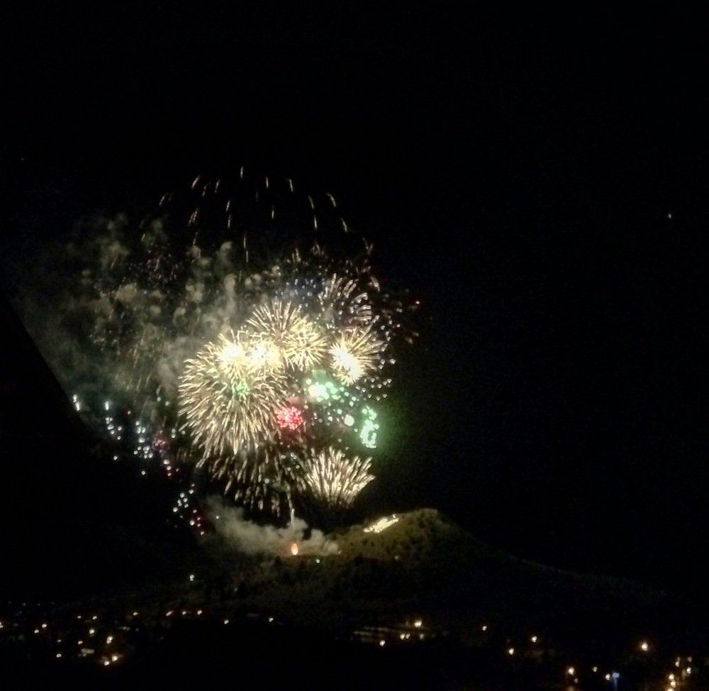 Kellie Gee Fireworks exploding in the night sky over  Butte, MT