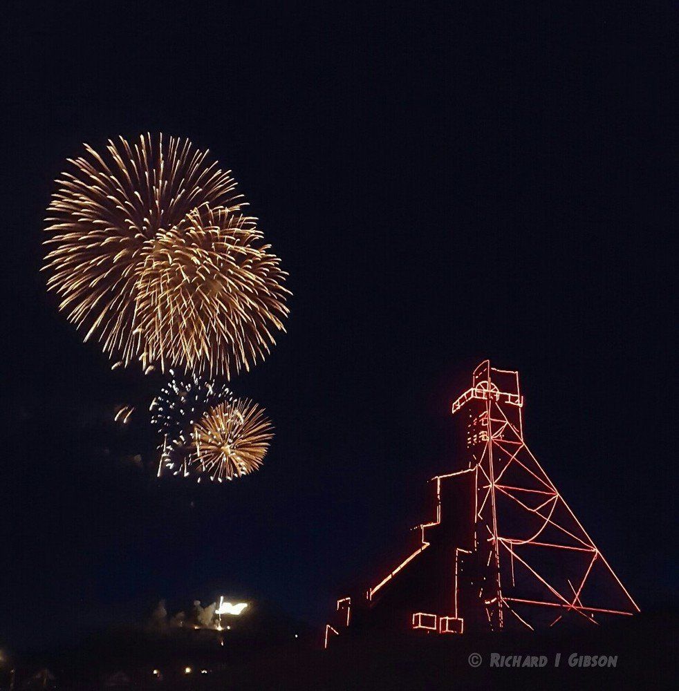 Richard Gibson Fireworks exploding in the night sky over  Butte, MT