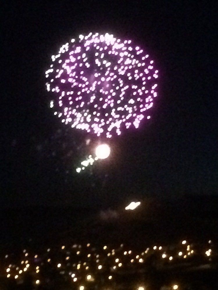 Zach Maunder Fireworks exploding in the night sky over  Butte, MT