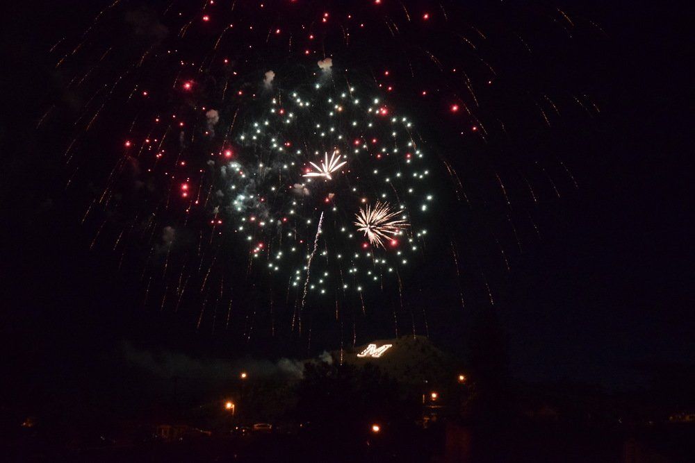 Robert Renouard Fireworks exploding in the night sky over  Butte, MT