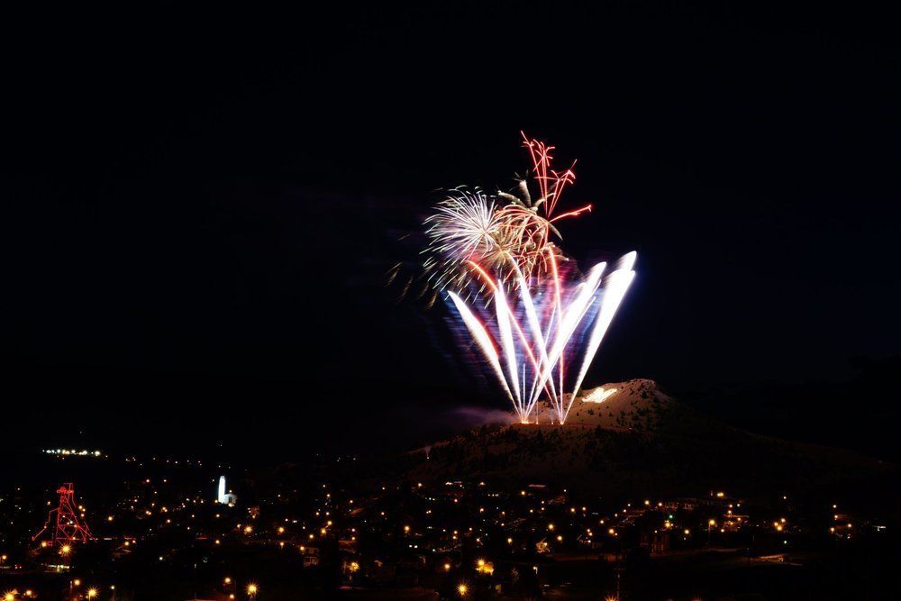 Bart Bratlien Fireworks exploding in the night sky over  Butte, MT