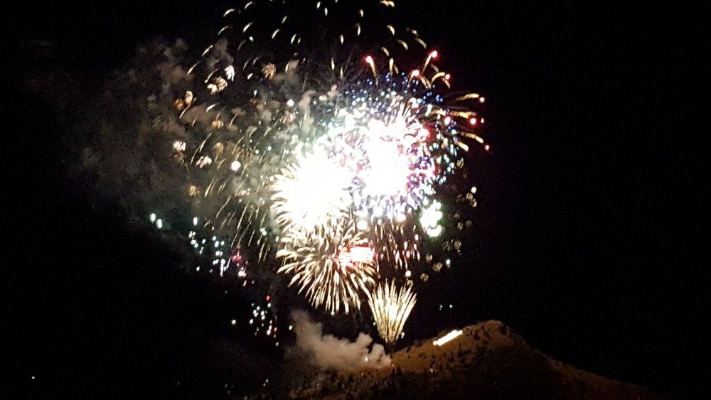 Katie Mattson Fireworks exploding in the night sky over  Butte, MT