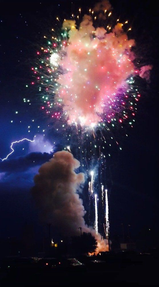 Kaitlyn Schumacher Fireworks exploding in the night sky over  Butte, MT