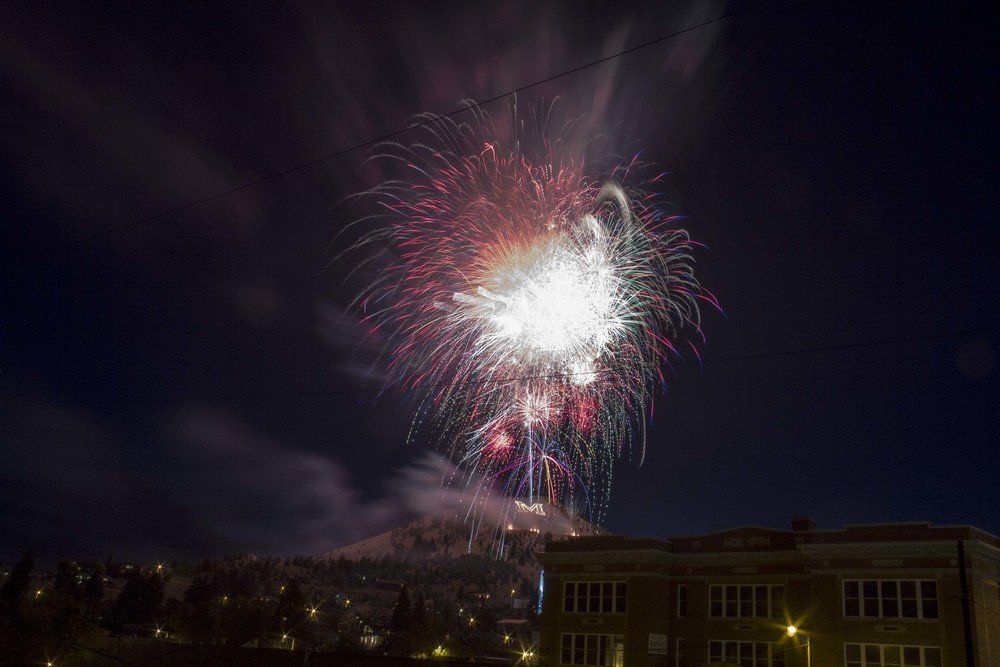 Gino Jolley Fireworks exploding in the night sky over  Butte, MT