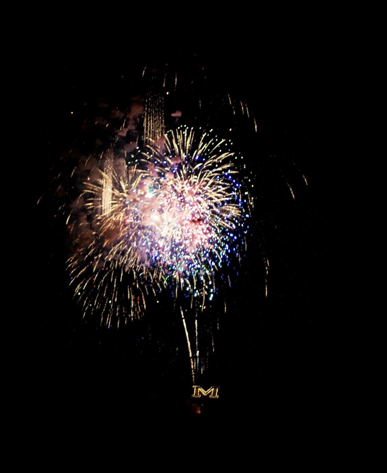 Kristen Parko Fireworks exploding in the night sky over  Butte, MT
