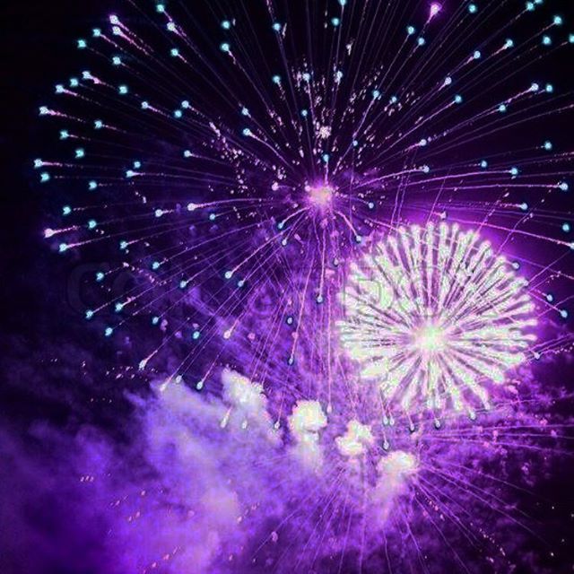 Angel Michels Fireworks exploding in the night sky over  Butte, MT