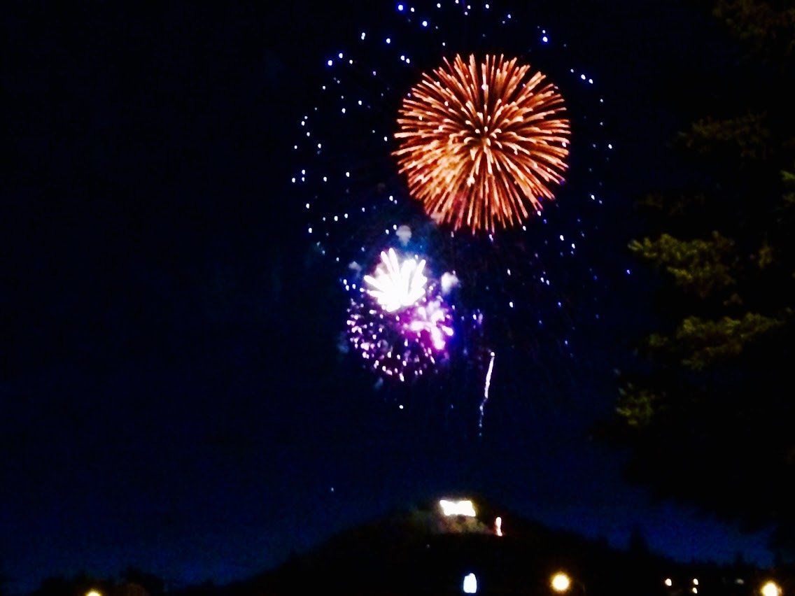 Nathon Elmose Fireworks exploding in the night sky over  Butte, MT