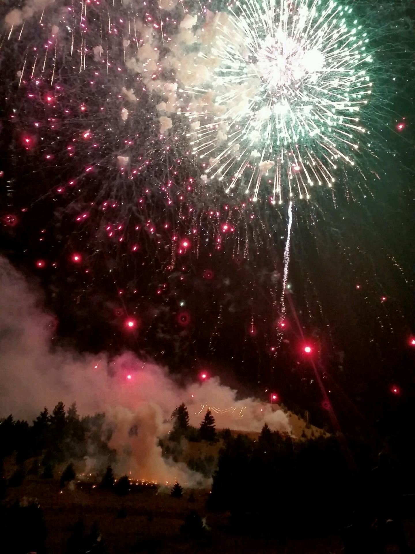 Caleb Salusso Fireworks exploding in the night sky over  Butte, MT