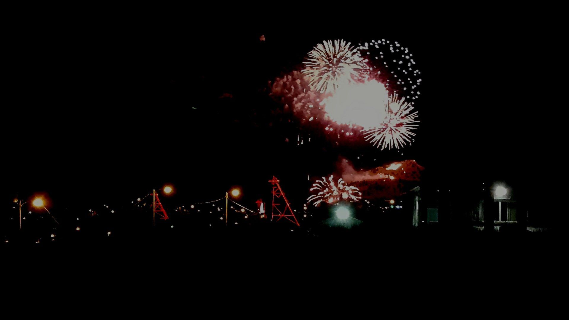 Alycia O'Hern Fireworks exploding in the night sky over  Butte, MT