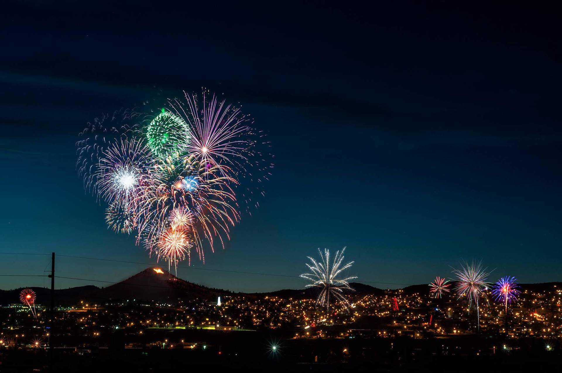 Steven Cordes Fireworks exploding in the night sky over  Butte, MT