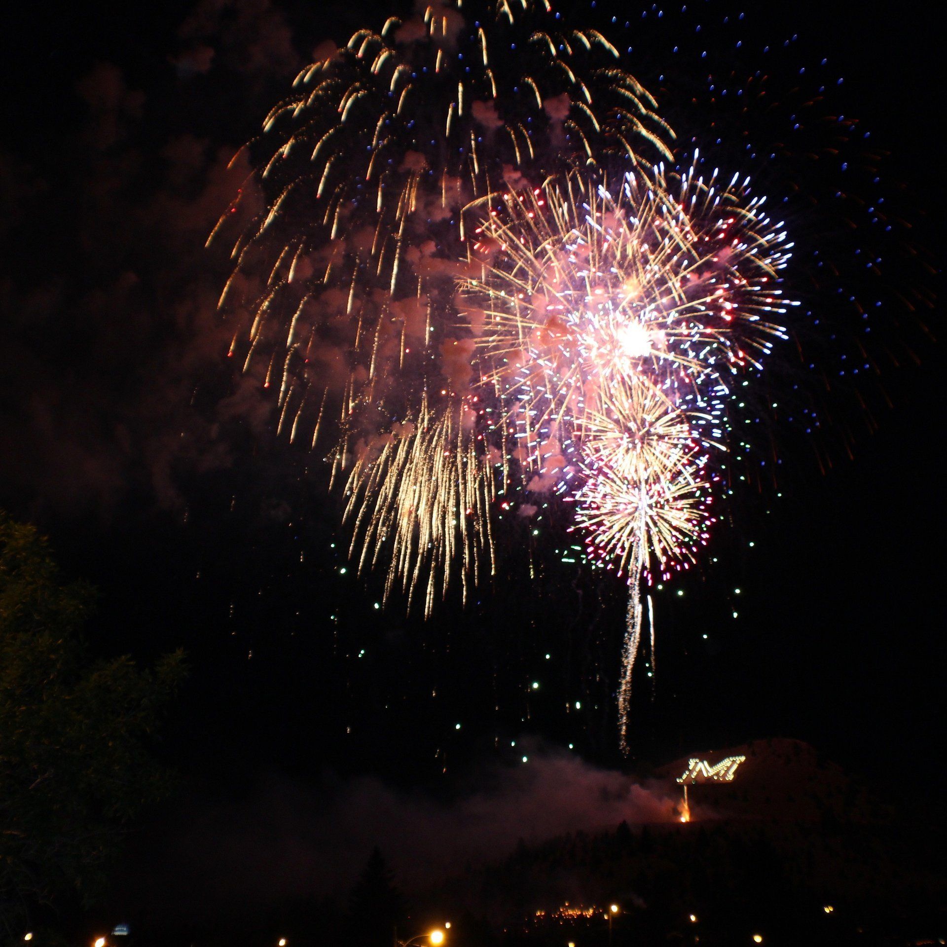 Autumn Badovinac Fireworks exploding in the night sky over  Butte, MT