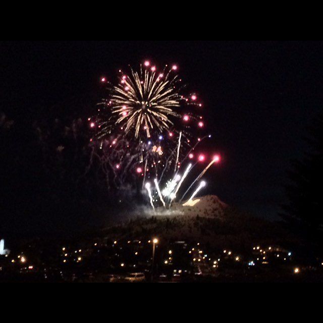 Shane Dehart Fireworks exploding in the night sky over  Butte, MT