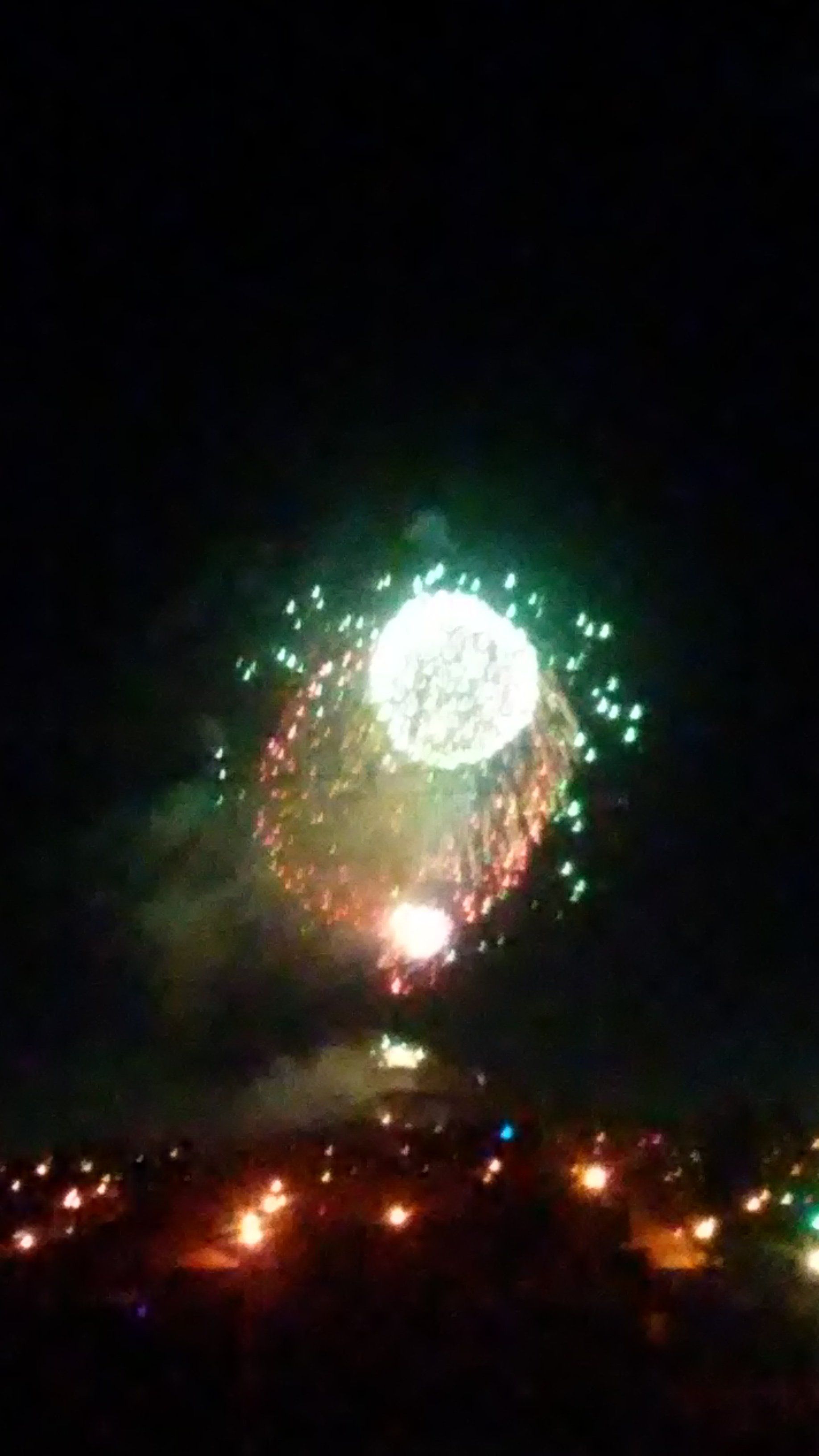 Karl Beranek Fireworks exploding in the night sky over  Butte, MT