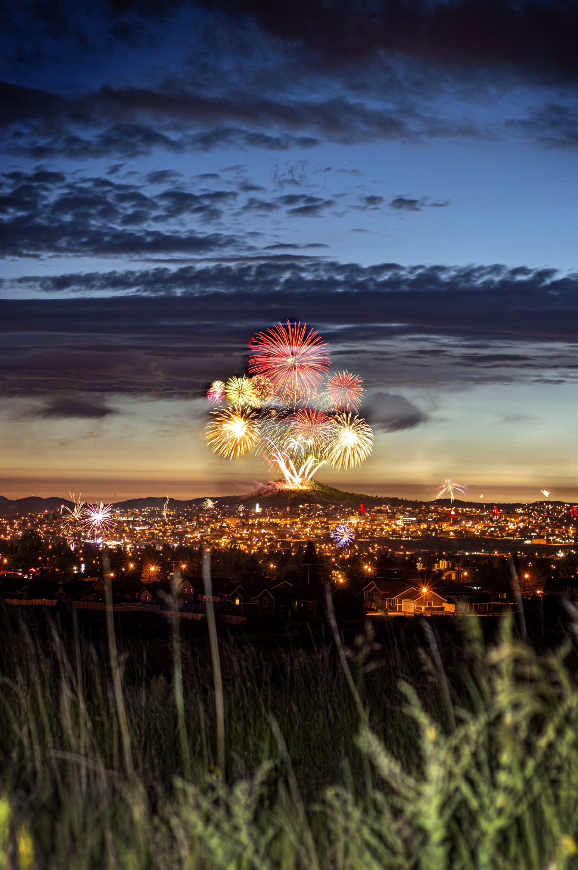 Fireworks exploding in the night sky over  Butte, MT