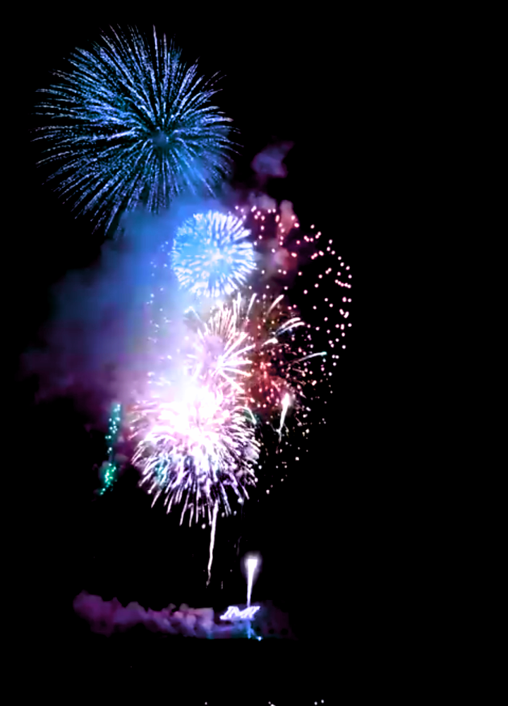 Fireworks exploding in the night sky over  Butte, MT