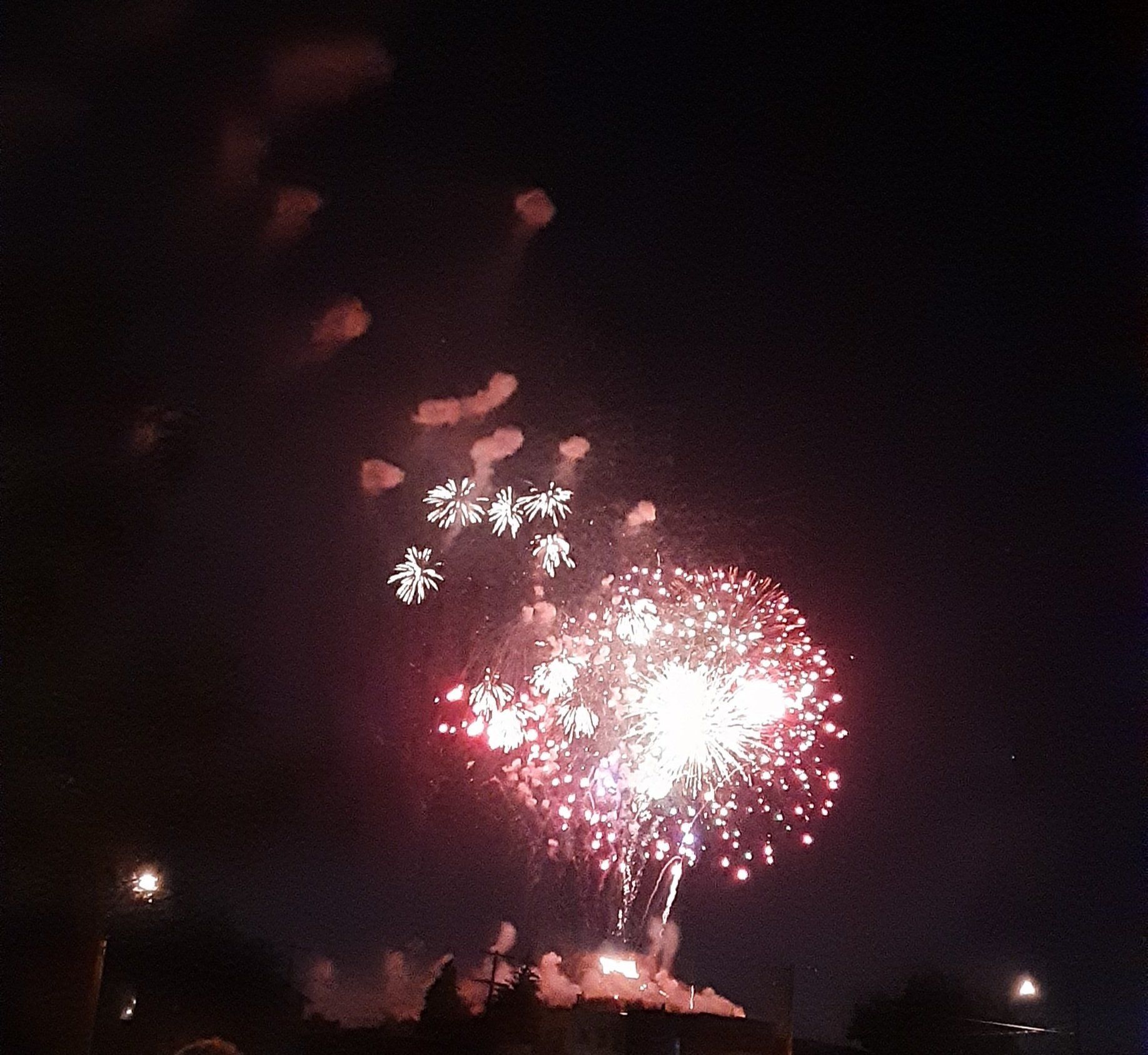 Fireworks exploding in the night sky over  Butte, MT