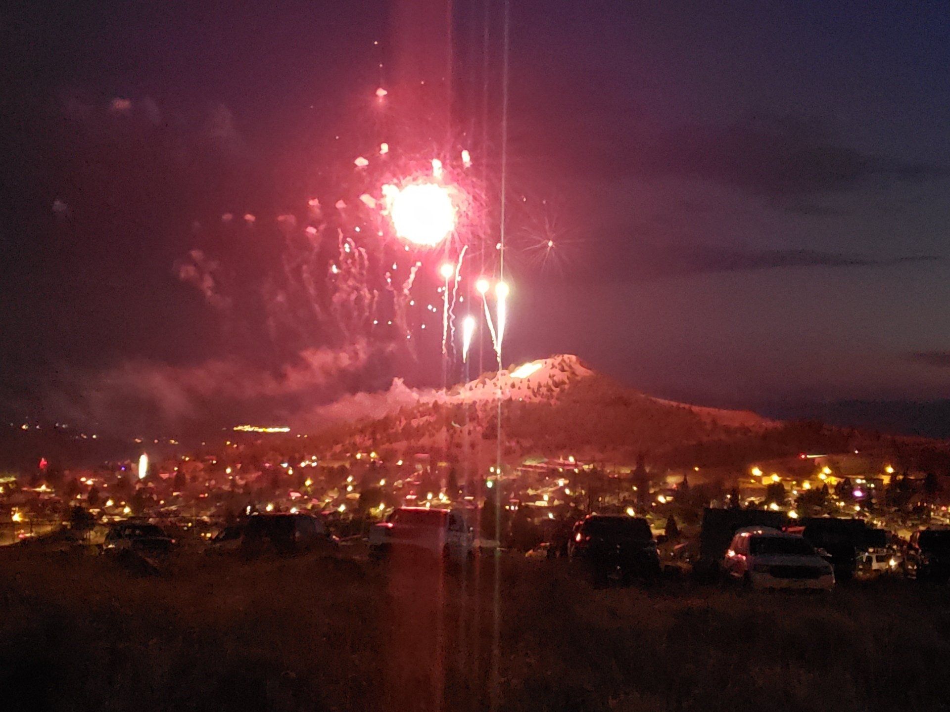 Fireworks exploding in the night sky over  Butte, MT