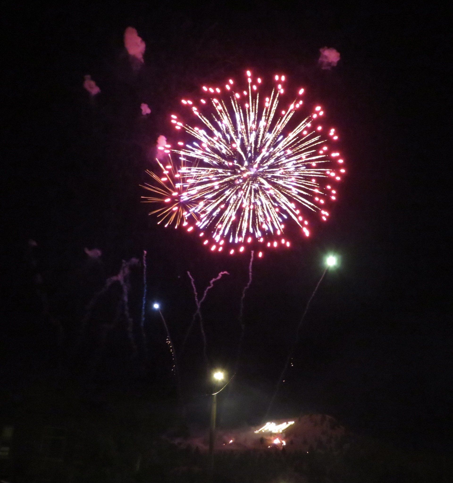 Fireworks exploding in the night sky over  Butte, MT
