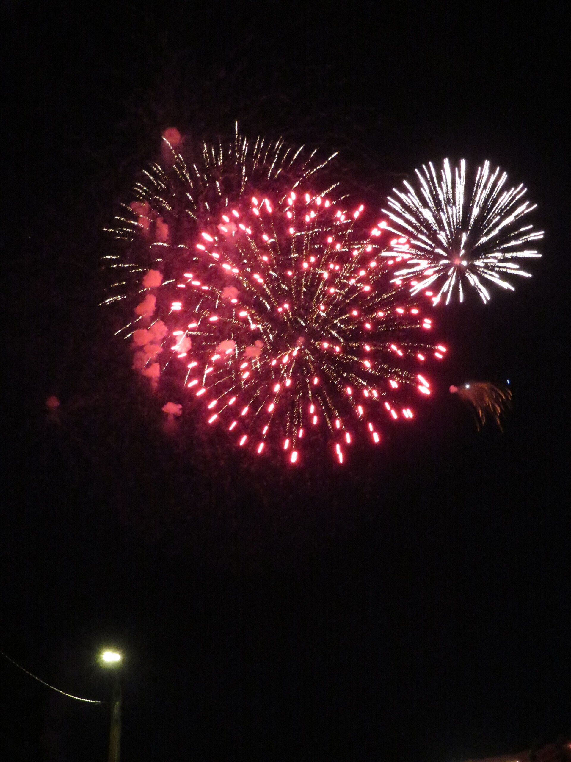 Fireworks exploding in the night sky over  Butte, MT
