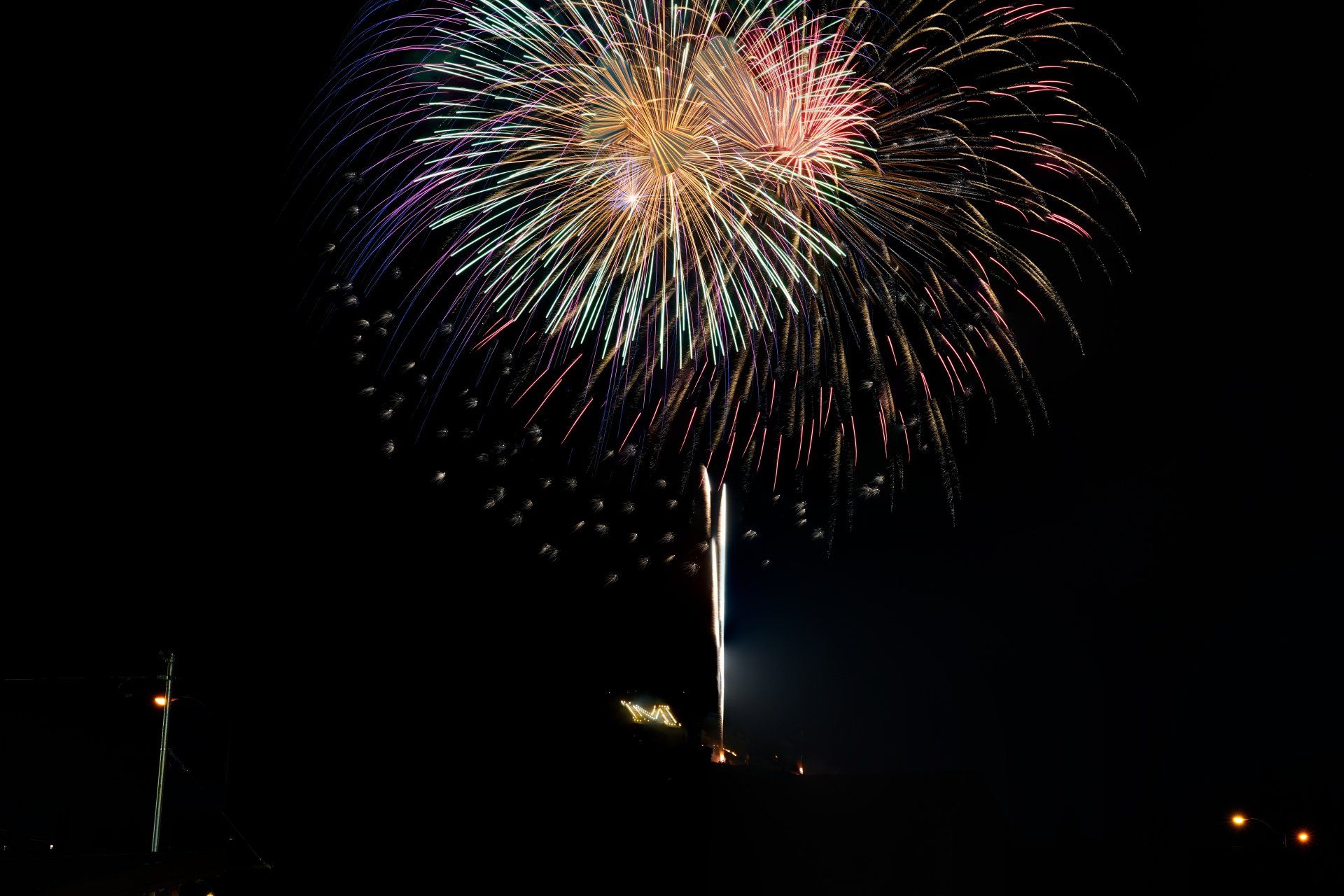 Fireworks exploding in the night sky over  Butte, MT