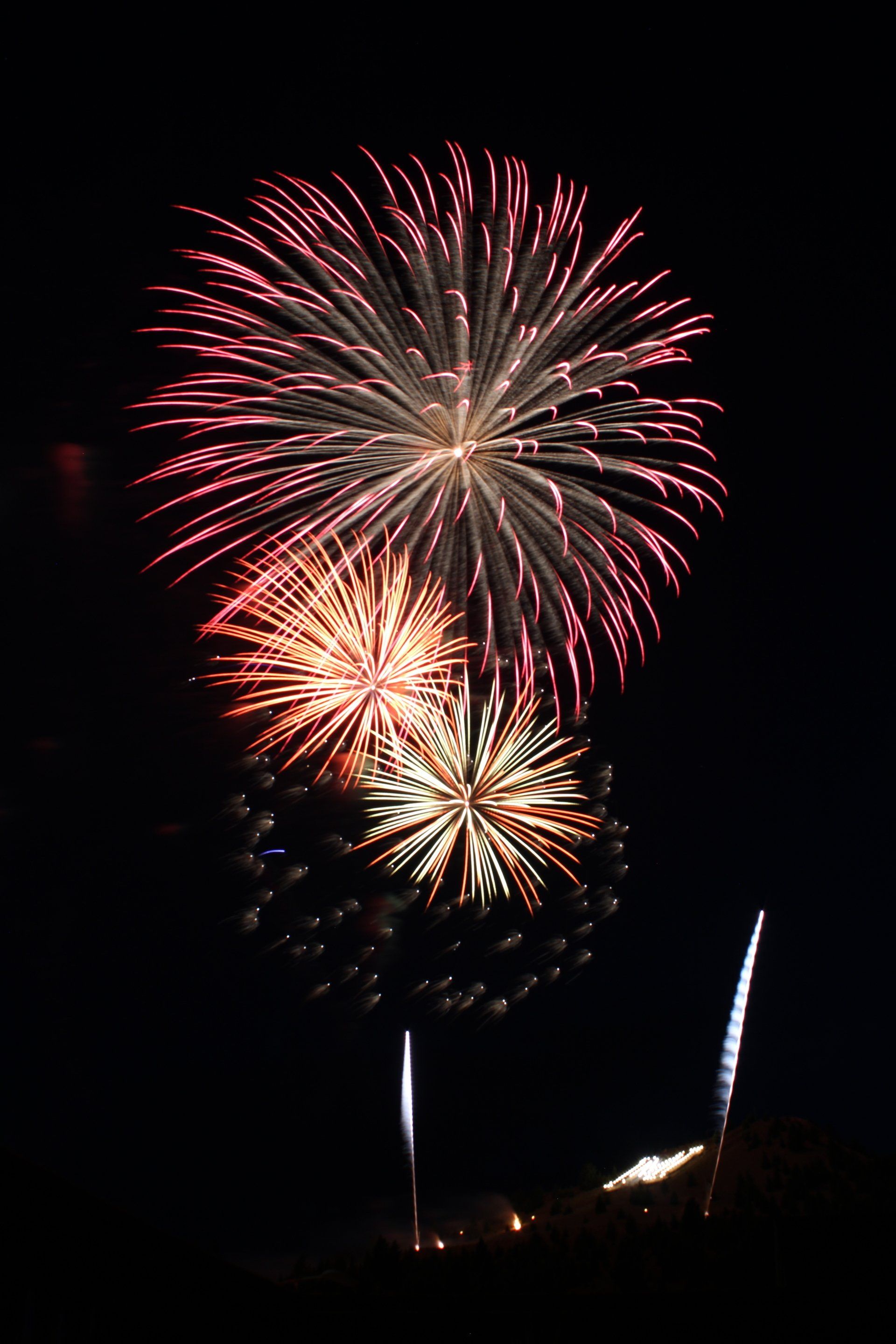 Fireworks exploding in the night sky over  Butte, MT