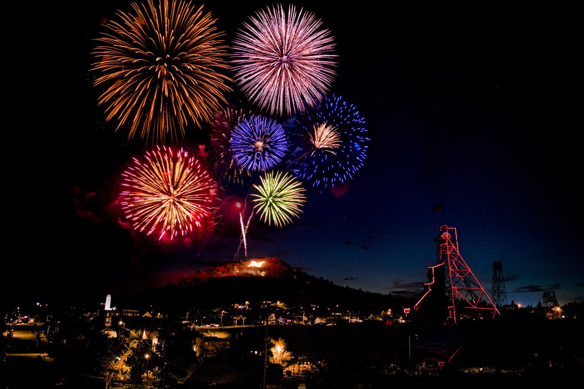Fireworks exploding in the night sky over  Butte, MT