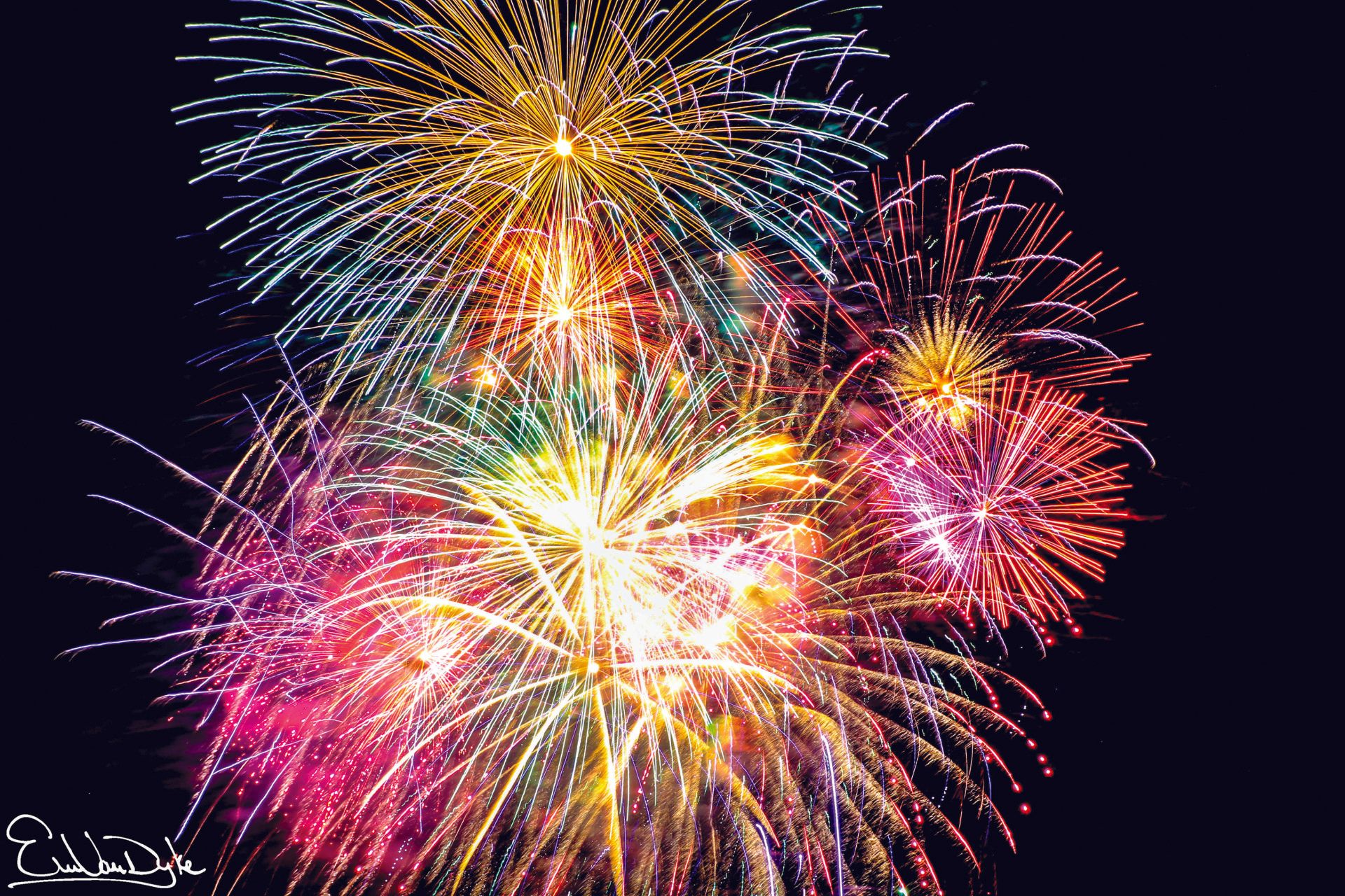 Fireworks exploding in the night sky over  Butte, MT