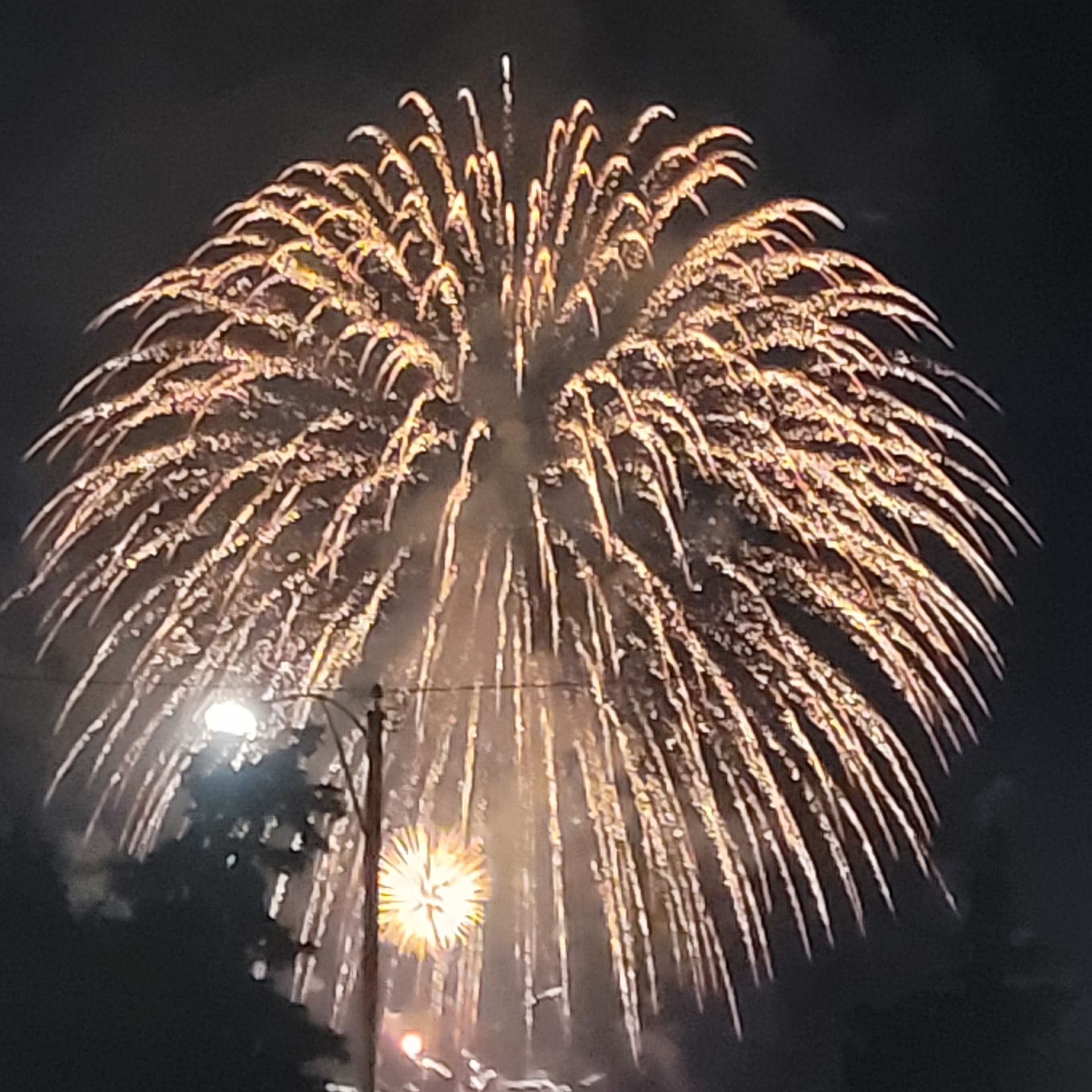 Fireworks exploding in the night sky over  Butte, MT