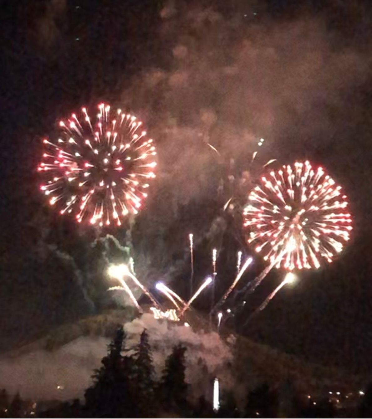 Fireworks exploding in the night sky over  Butte, MT